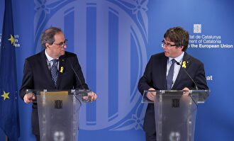 Torra y Puigdemont en un encuentro en Bruselas. | EFE