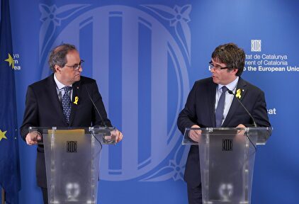 El presidente catalán, Quim Torra y el fugado Carles Puigdemont | EFE
