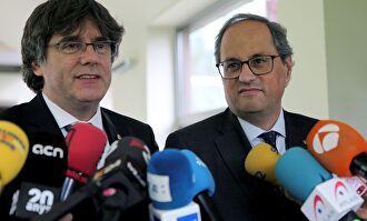 Puigdemont y Torra en una imagen de archivo. | EFE