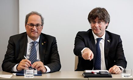 Torra y Puigdemont en un encuentro en Bruselas. | EFE