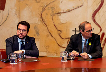Pere Aragonés y Quim Torra. | EFE