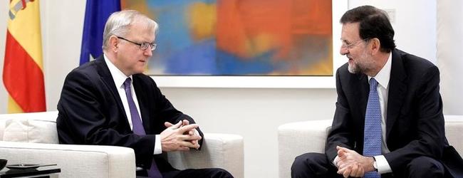 El comisario de Asuntos Econmicos, Olli Rehn, junto al presidente del Gobierno, Mariano Rajoy | Archivo