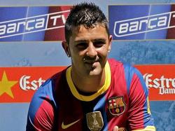 Villa posa con la camiseta del Barcelona. | EFE