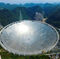 A 500-metre (1,640-ft.) aperture spherical telescope (FAST) is seen at the final stage of construction, among the mountains in Pingtang county, Guizhou province, China, May 7, 2016.
