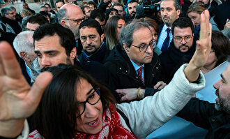El presidente catalán, Quim Torra, huyendo de una manifestación separatista en Madrid |  EFE
