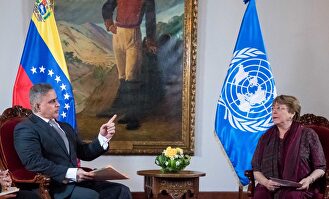 El fiscal general, Tarek Saab,y Michelle Bachelet. |  EFE