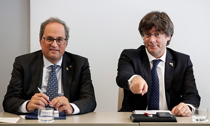 Torra y Puigdemont. | EFE