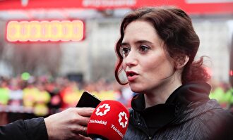 La presidenta de la Comunidad de Madrid, Isabel Díaz Ayuso, antes de participar en la Carrera de las Empresas. |  EFE