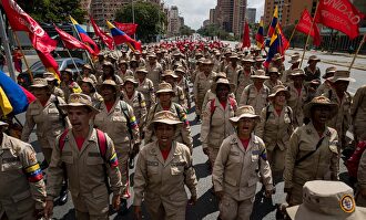 Milicianos durante una manifestación de chavismo. |  EFE
