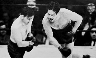 Braddock golpea a Baer en la pelea por el título mundial. | Youtube