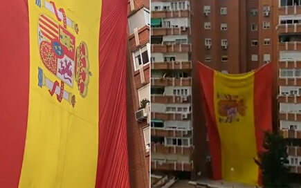 Vecinos de Madrid izan una bandera de España gigante en su edificio