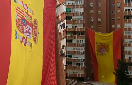 Vecinos de Madrid izan una bandera de España gigante en su edificio