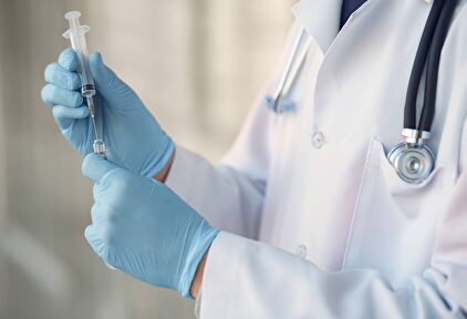 person in white long sleeve shirt holding injection | Pexels/CC0/Gustavo Fring