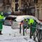 Operarios del servicio de limpieza del Ayuntamiento retiran nieve en una calle de Madrid este lunes tras el paso de la borrasca Filomena.