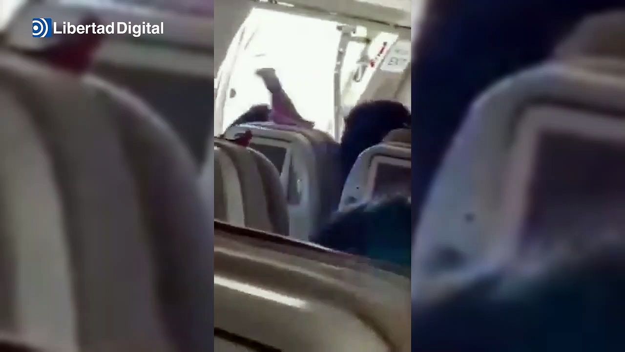 Panic in an airplane when a passenger opens the emergency exit in mid-flight