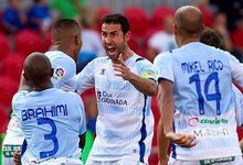 Los jugadores del Granada celebran el tanto de El Arabi. | EFE