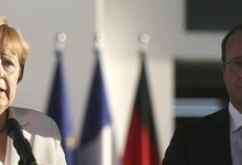 Merkel y Hollande enfrente de la cancillera de Berln, este jueves. |Efe