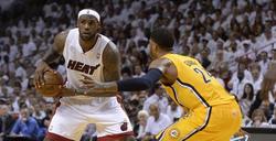 LeBron James, de los Heat ,en acción ante Paul George, de los Pacers. | EFE