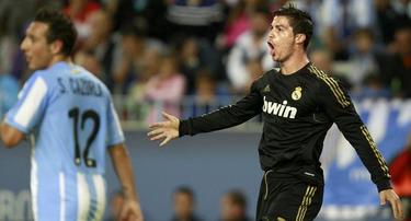 Cristiano Ronaldo celebra su segundo gol al Mlaga. | EFE