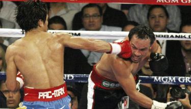 Pacquiao golpea a Mrquez. | EFE