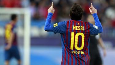 Messi celebra uno de sus goles al Mlaga. | EFE