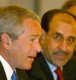 George W. Bush y Nuri al Maliki.